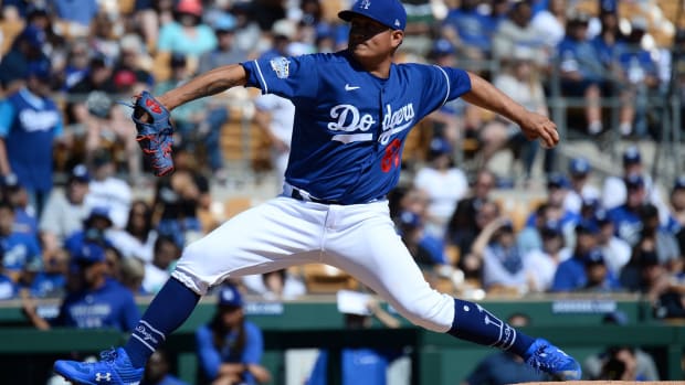 Mar 1, 2020; Phoenix, Arizona, USA; Los Angeles Dodgers starting pitcher Victor Gonzalez (81) pitches against the Texas Rangers during the first inning at Camelback Ranch. Mandatory Credit: Joe Camporeale-USA TODAY Sports